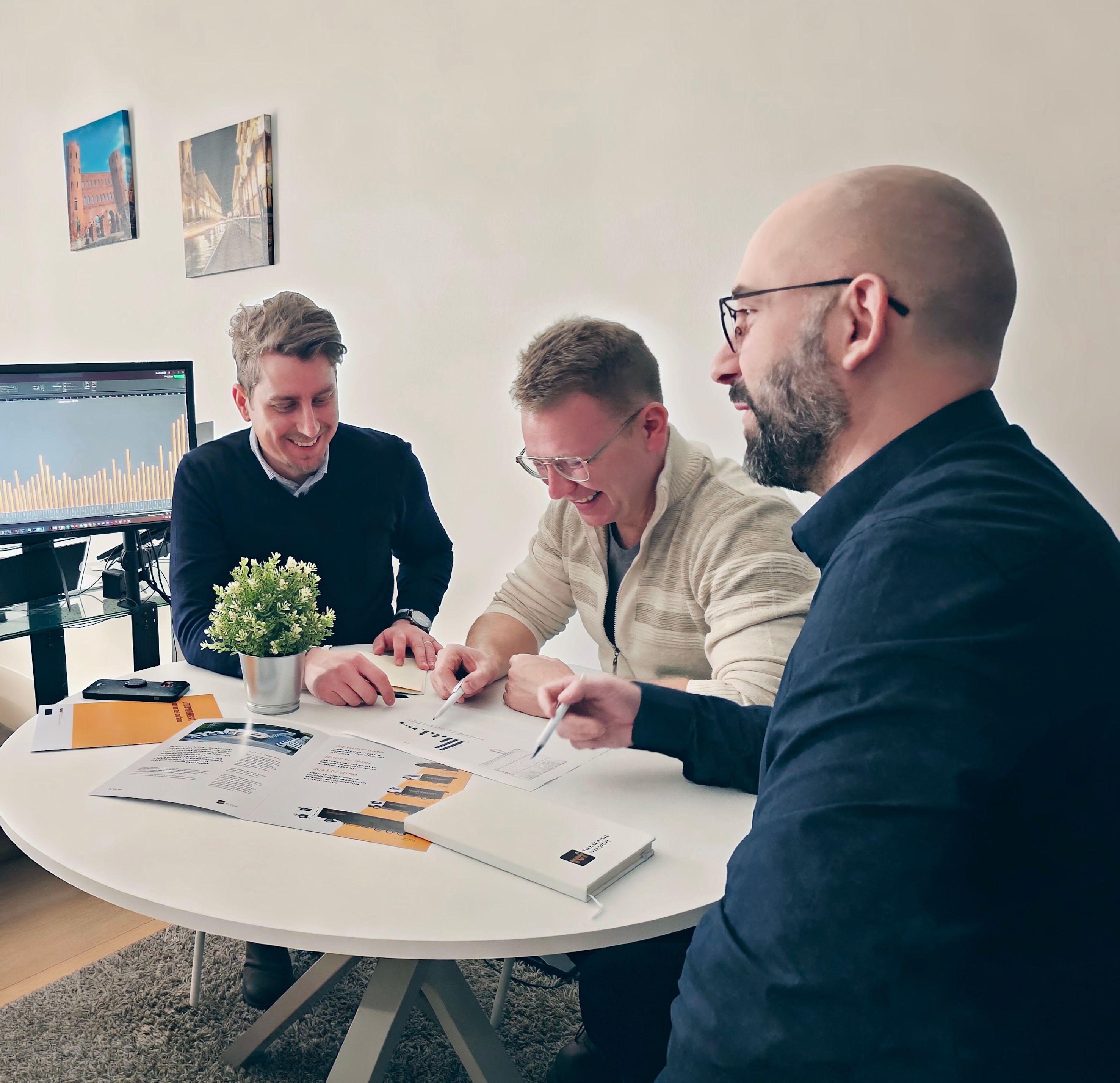 Three TCT24 colleagues around the table in the Turin office